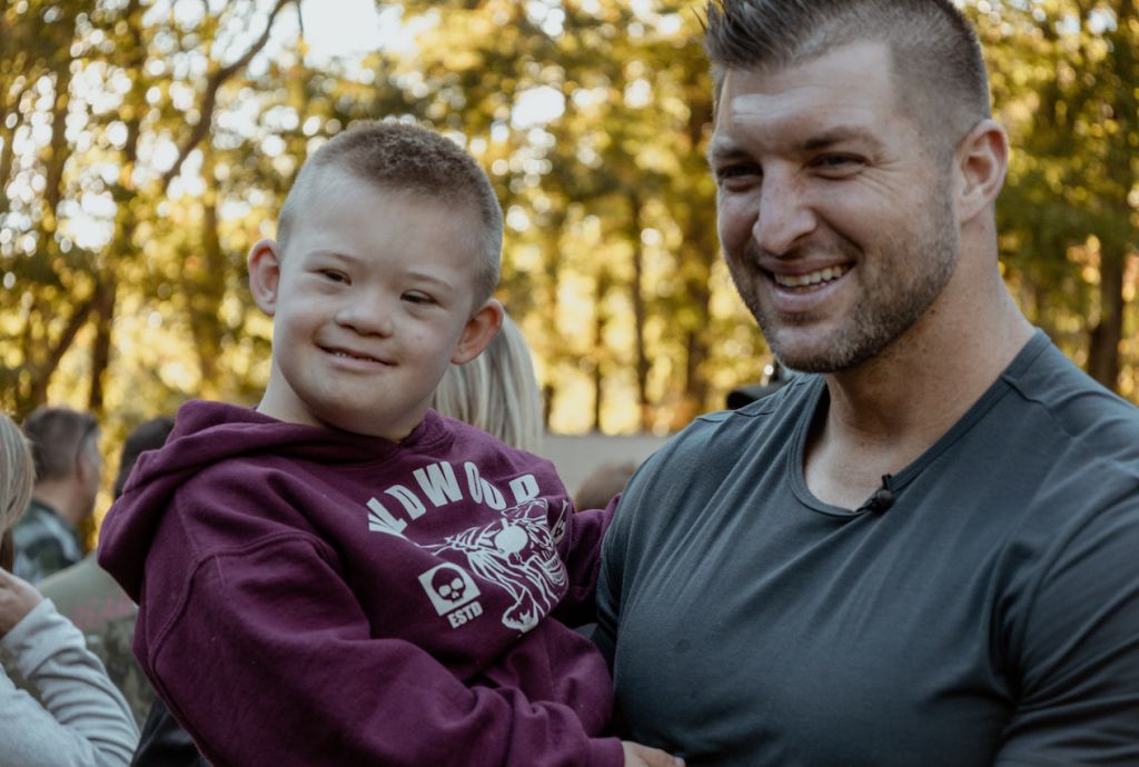 Tim Tebow with child